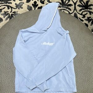 Lavender MadHappy sweatshirt.